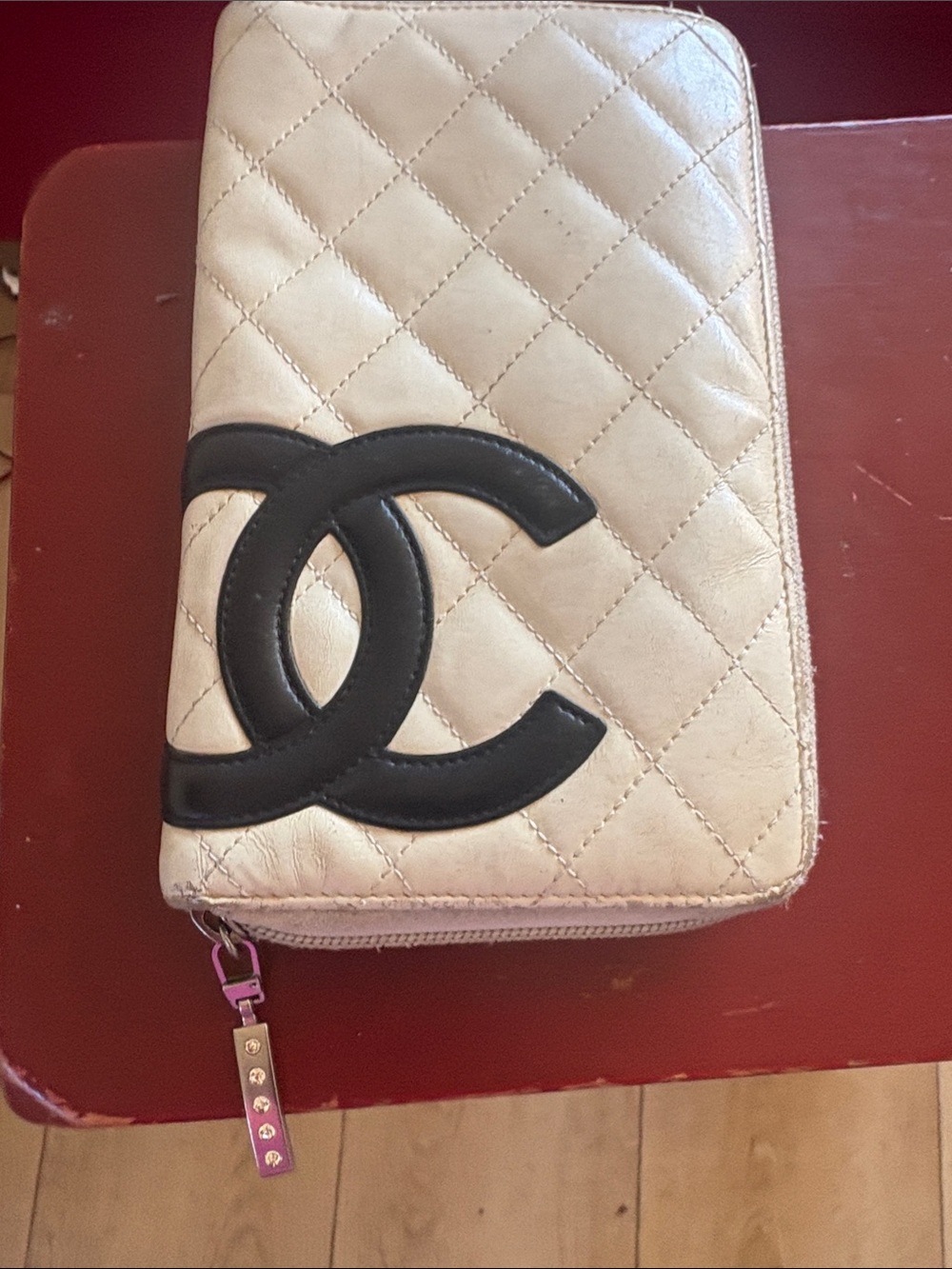 CHANEL Quilted Zip Wallet in Cream with Black CC